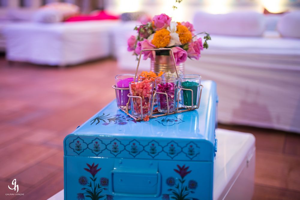 Photo of Blue trunks with floral arrangement in decor