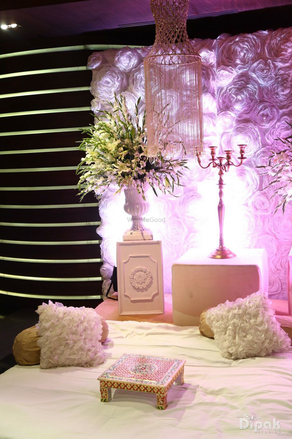 Photo of White and pink low seating idea with furry cushions