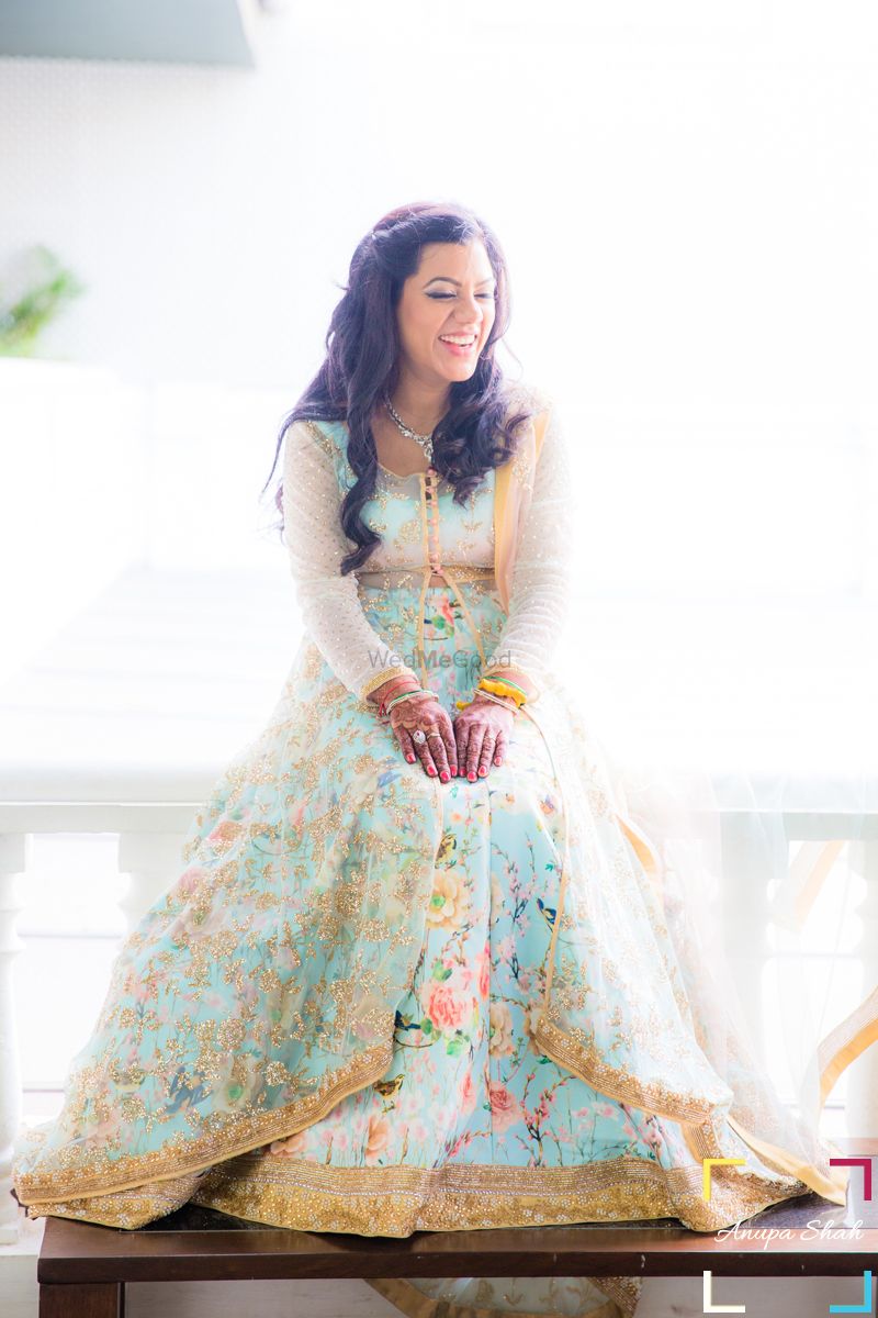 Photo of Pastel Floral Lehenga with Net Jacket and Gold Border