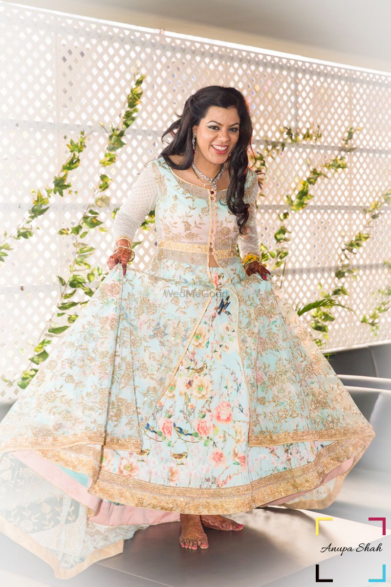 Photo of Pastel Floral Lehenga with Gold Border and Net Jacket