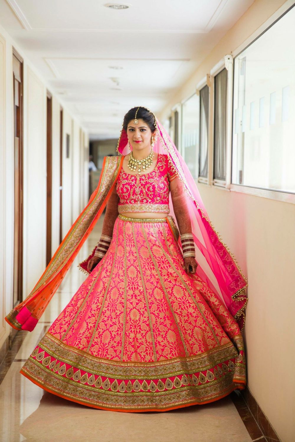 Photo of Bright pink benarasi bridal lehenga