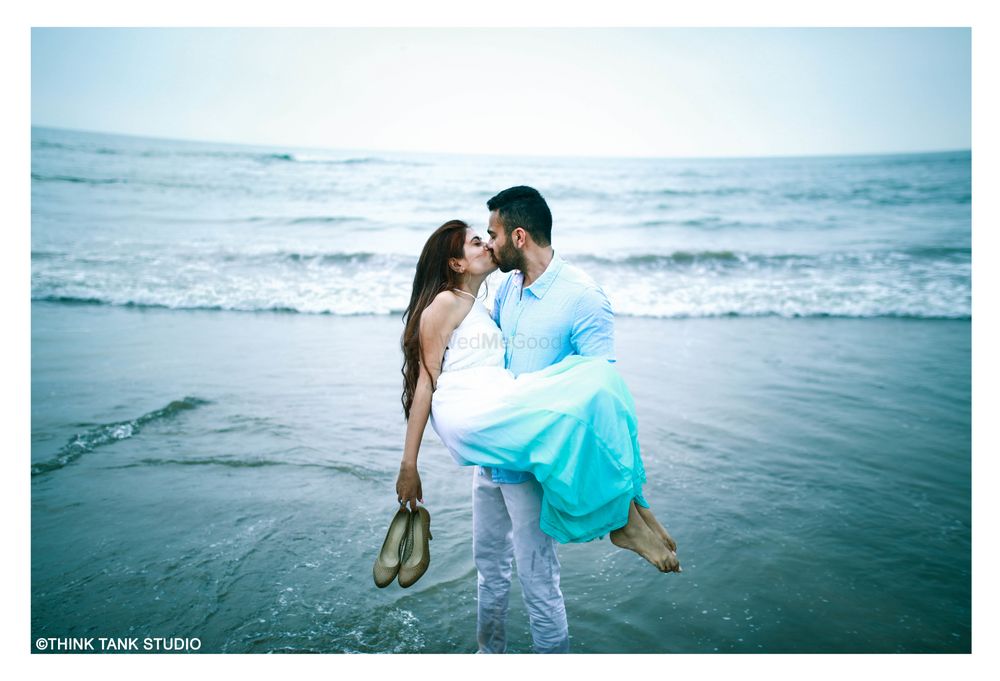 Photo of Romantic couple kissing on beach shot