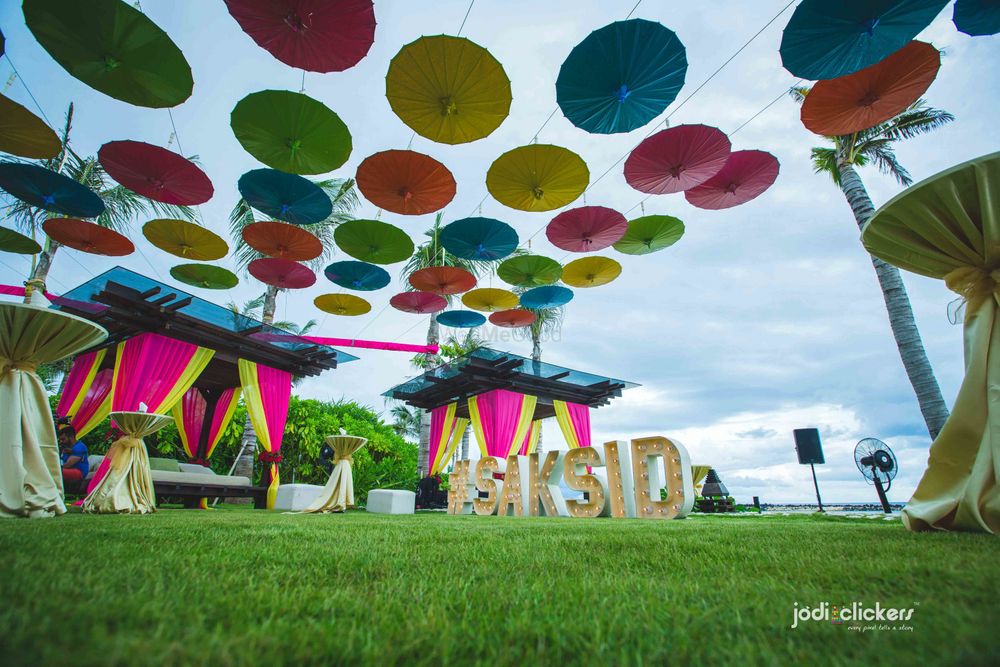 Photo of Hanging umbrellas with giant wedding hashtag