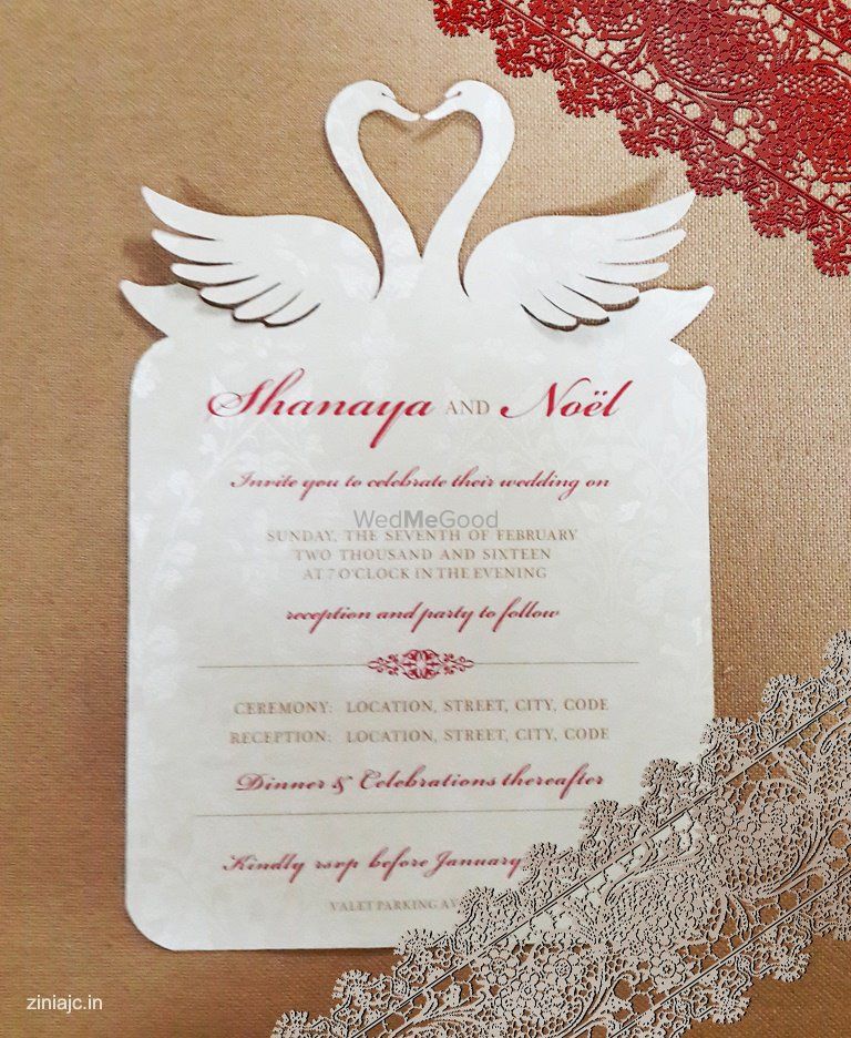 Photo of cutout wedding cardm swan motif