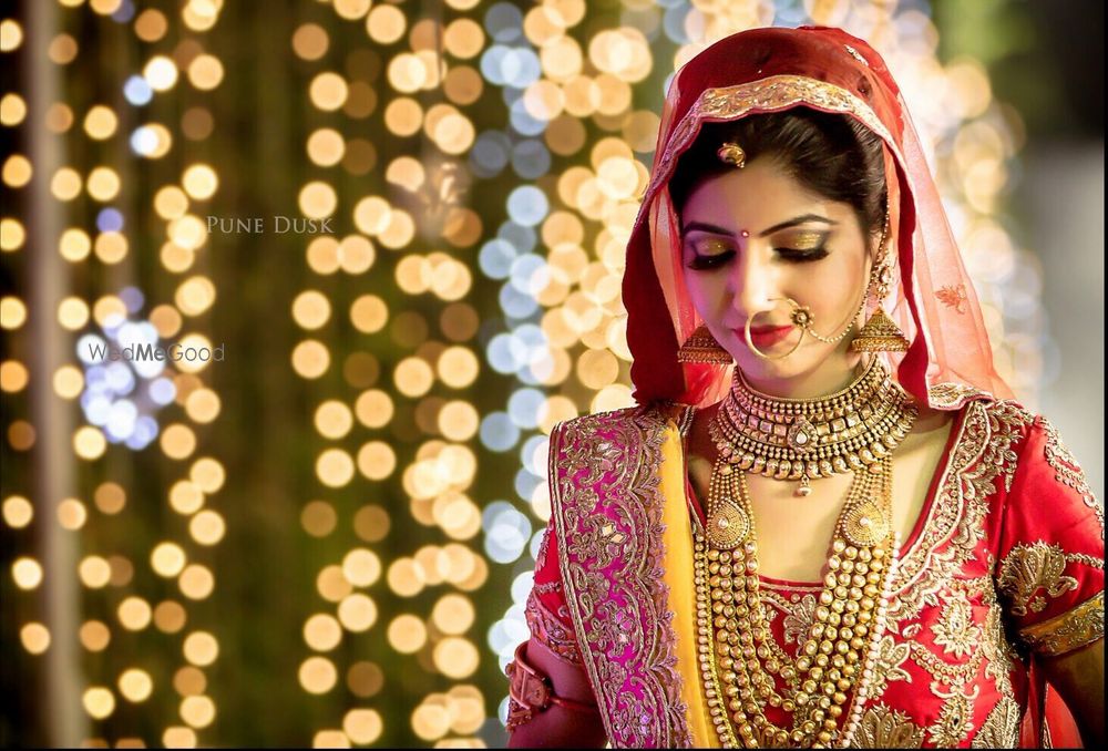 Photo of Red Bride Portrait with Fairy Lights Backdrop