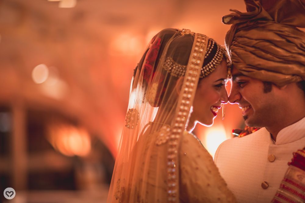 Photo of Bright and happy couple shot in gold