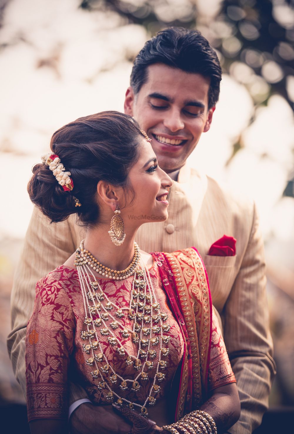 Photo of A bride and groom in coordinated outfits