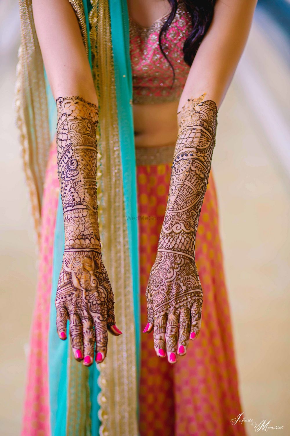 Photo of Bridal hands showing off mehendi till elbow