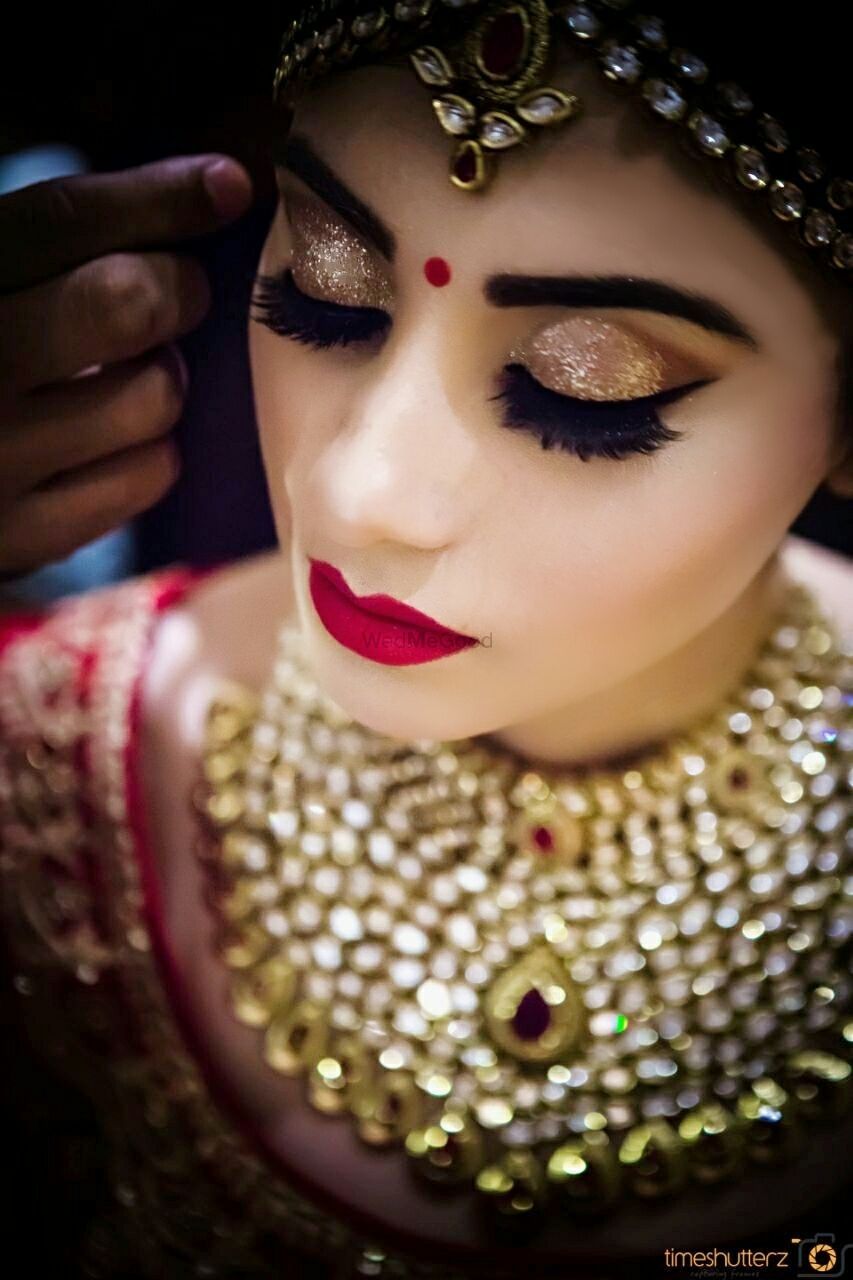 Photo of Bride with bold brows and red lips
