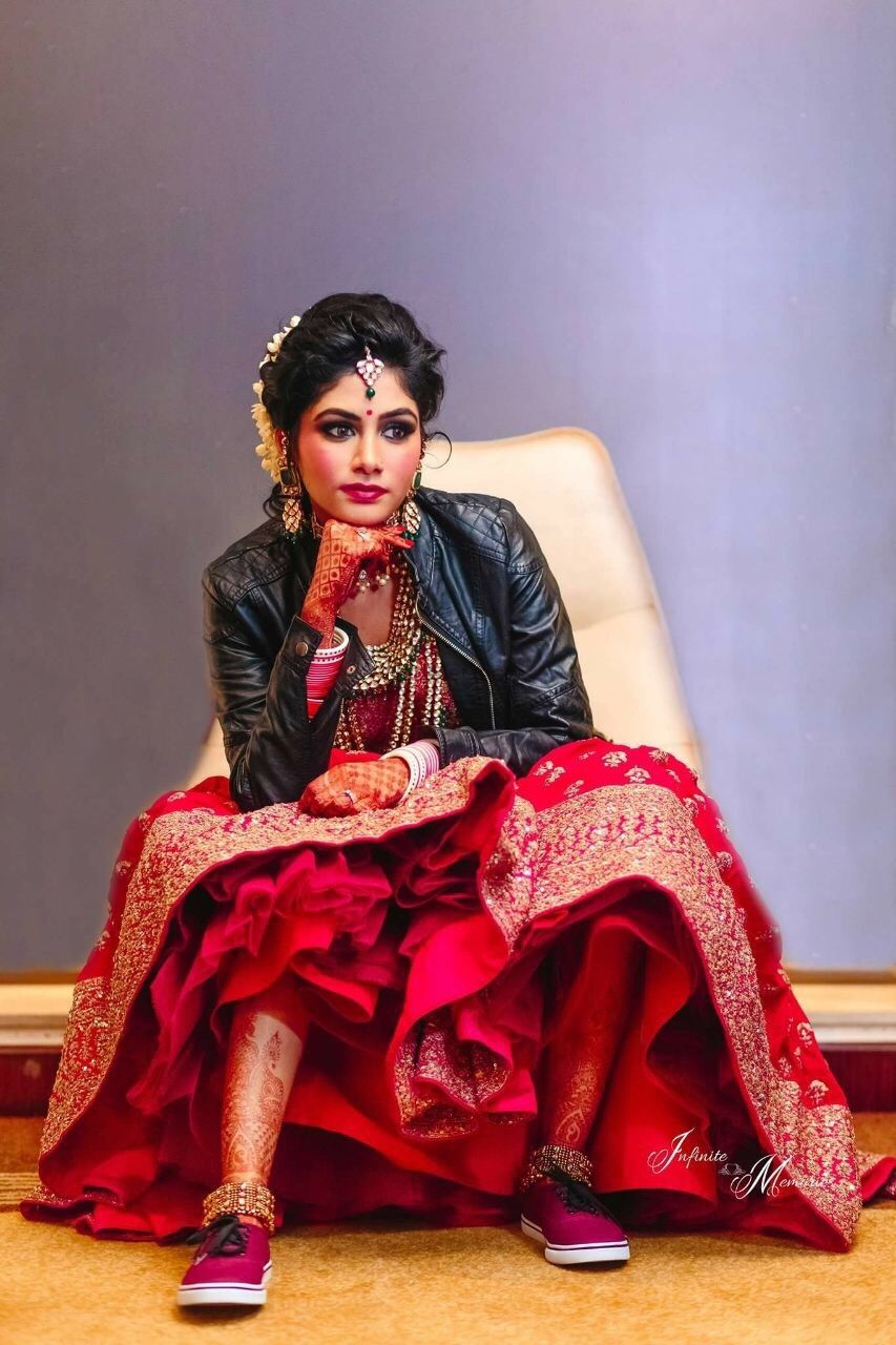 Photo of Modern bride with lehenga and leather jacket and sneakers