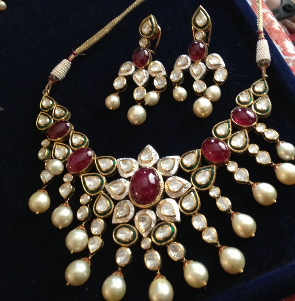 Photo of Sitara kundan and rubies with pearls