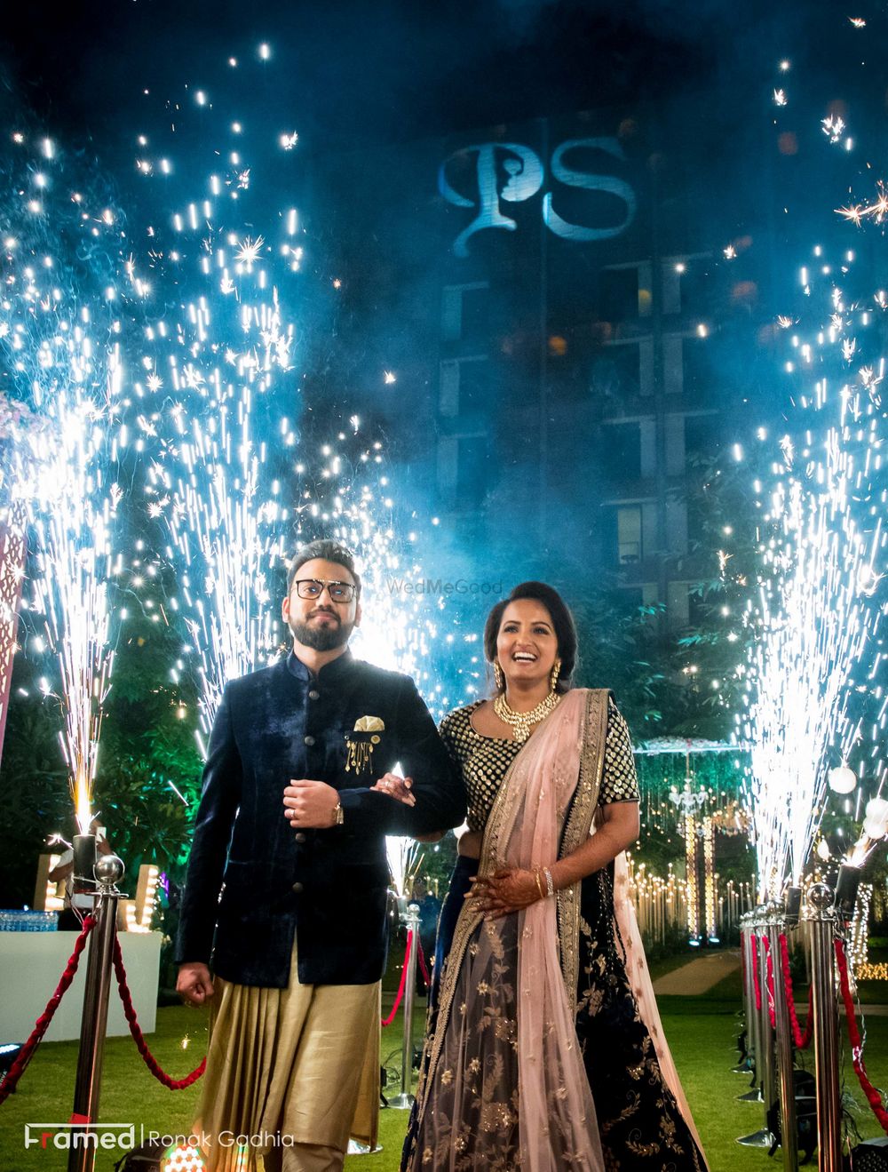 Photo of Couple entering on engagement with cold pyros