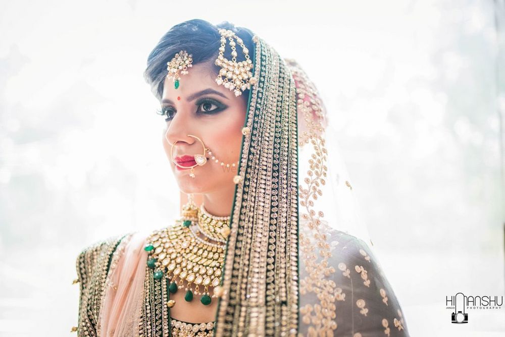 Photo of Bridal portrait with heavy bridal jewellery and dupatta