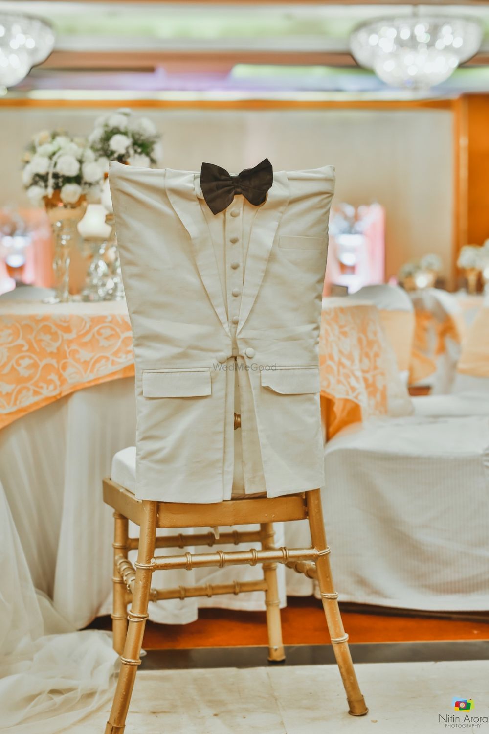 Photo of Groom chair with bow tie and suit