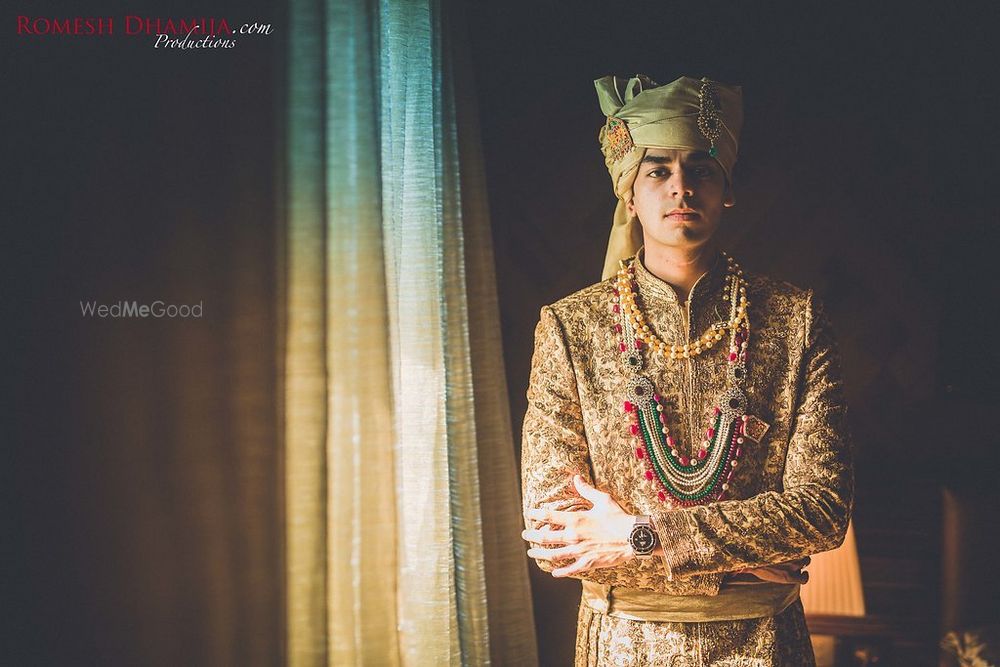 Photo of Beige sherwani with pista green necklace