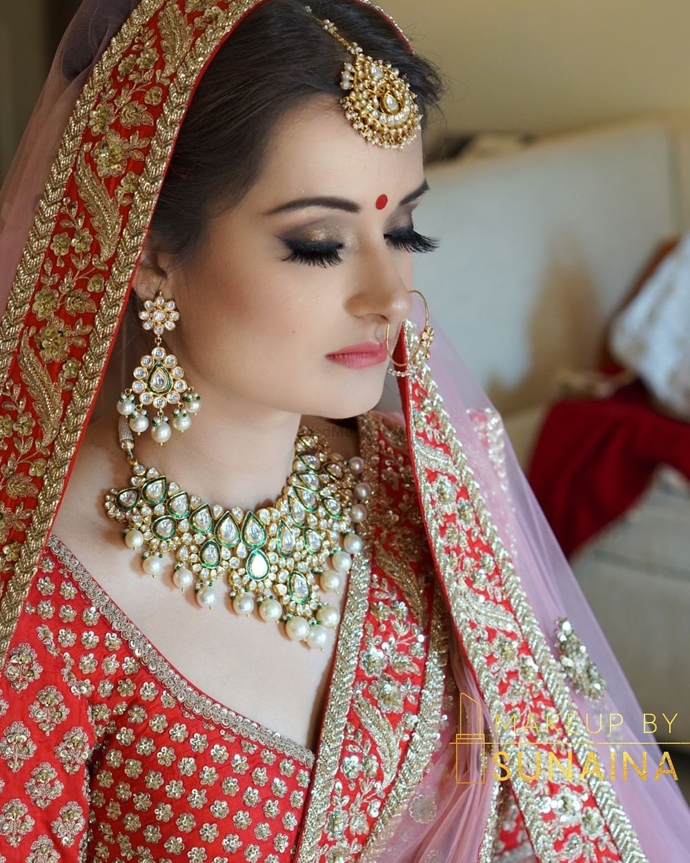 Photo of Bridal portrait in red with contrasting jewellery
