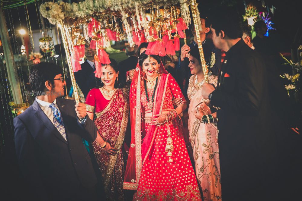 Photo of Bride entering under matching phoolon ka chadar