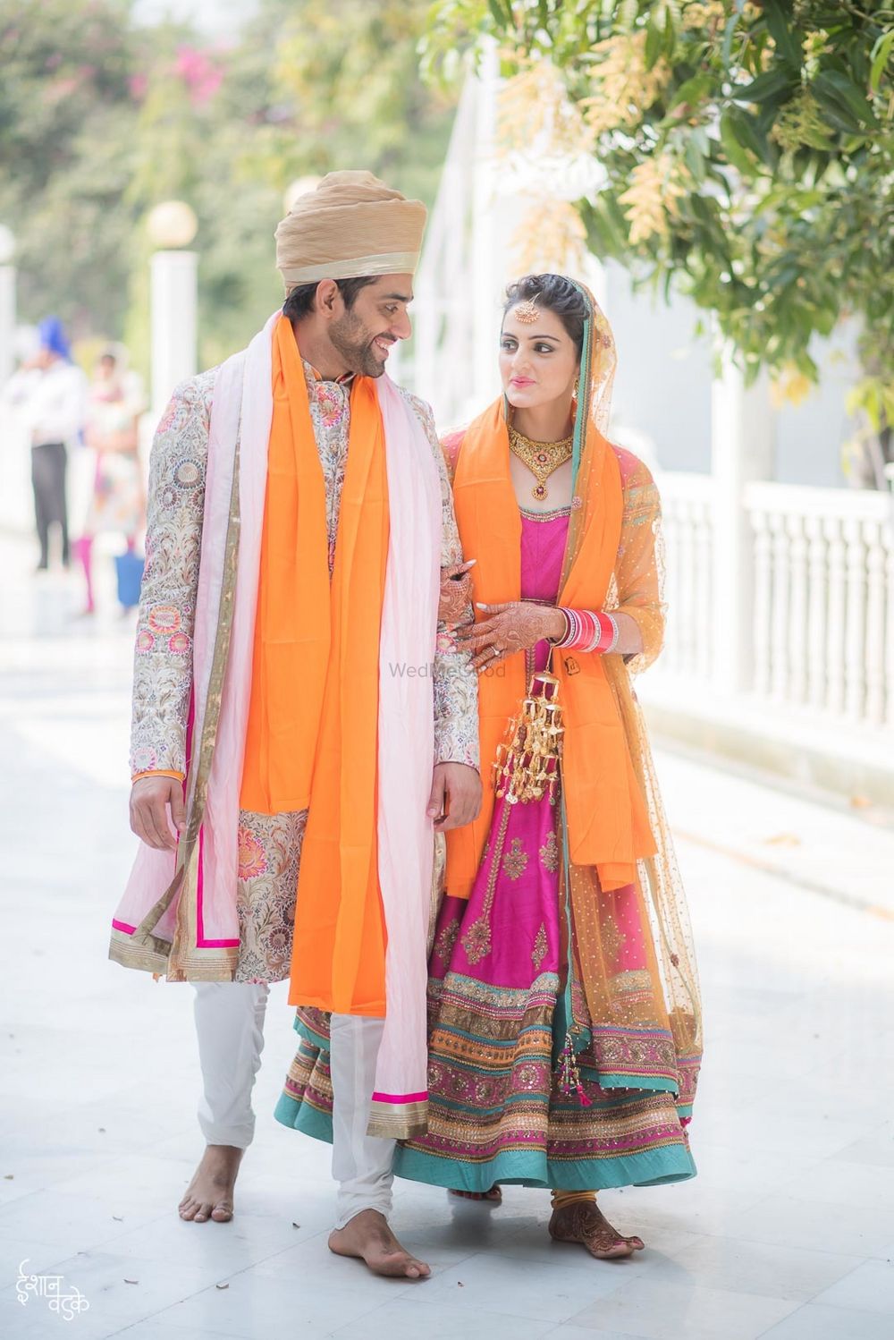 Photo of Sikh couple in coordinated outfits morning wedding