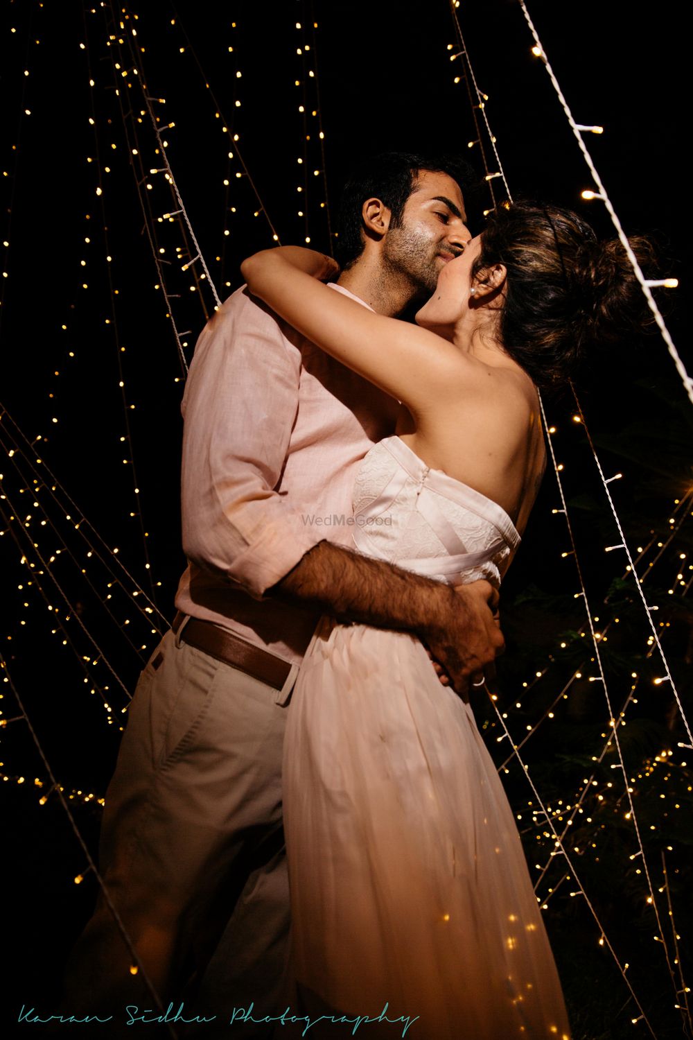 Photo of Couple portrait with fairy light backdrop