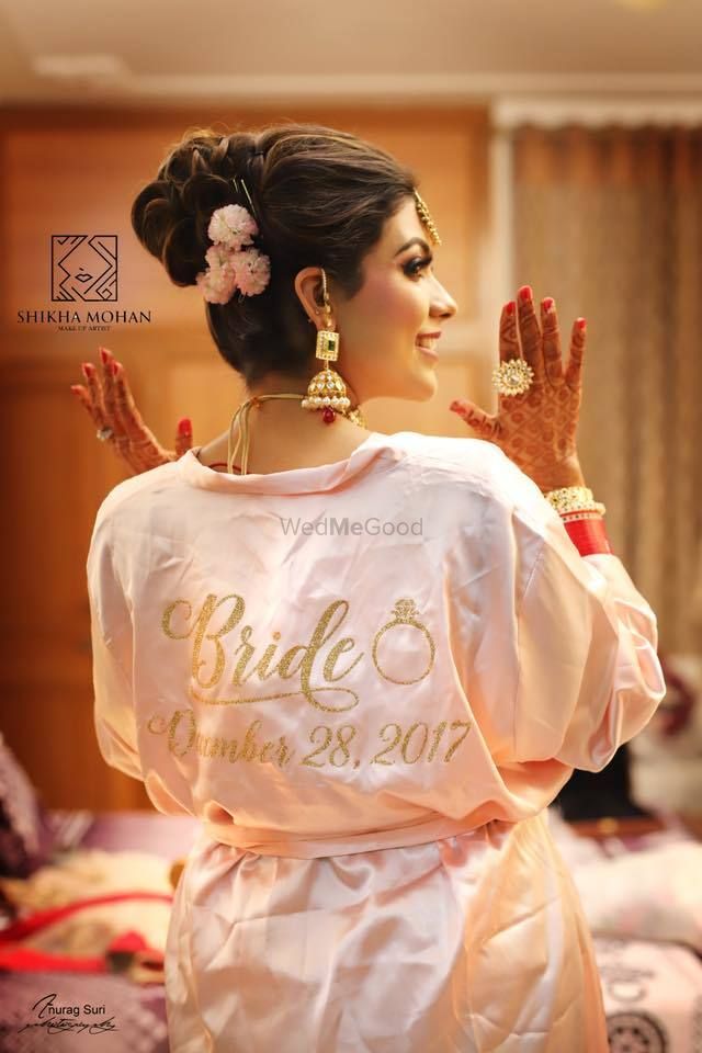 Photo of Bride getting ready shot idea with customised robe with wedding date