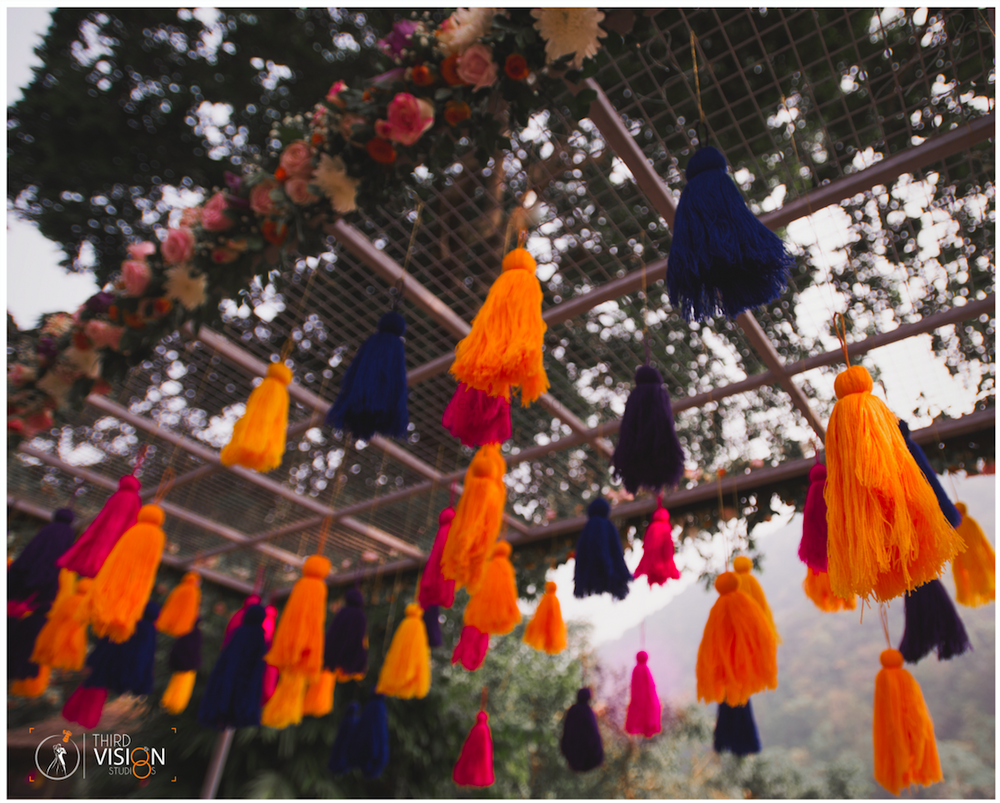 Photo of Mehendi entrance decor with hanging tassels