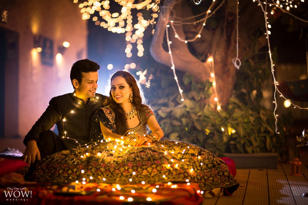 Photo of Couple engagement portrait with fairy lights