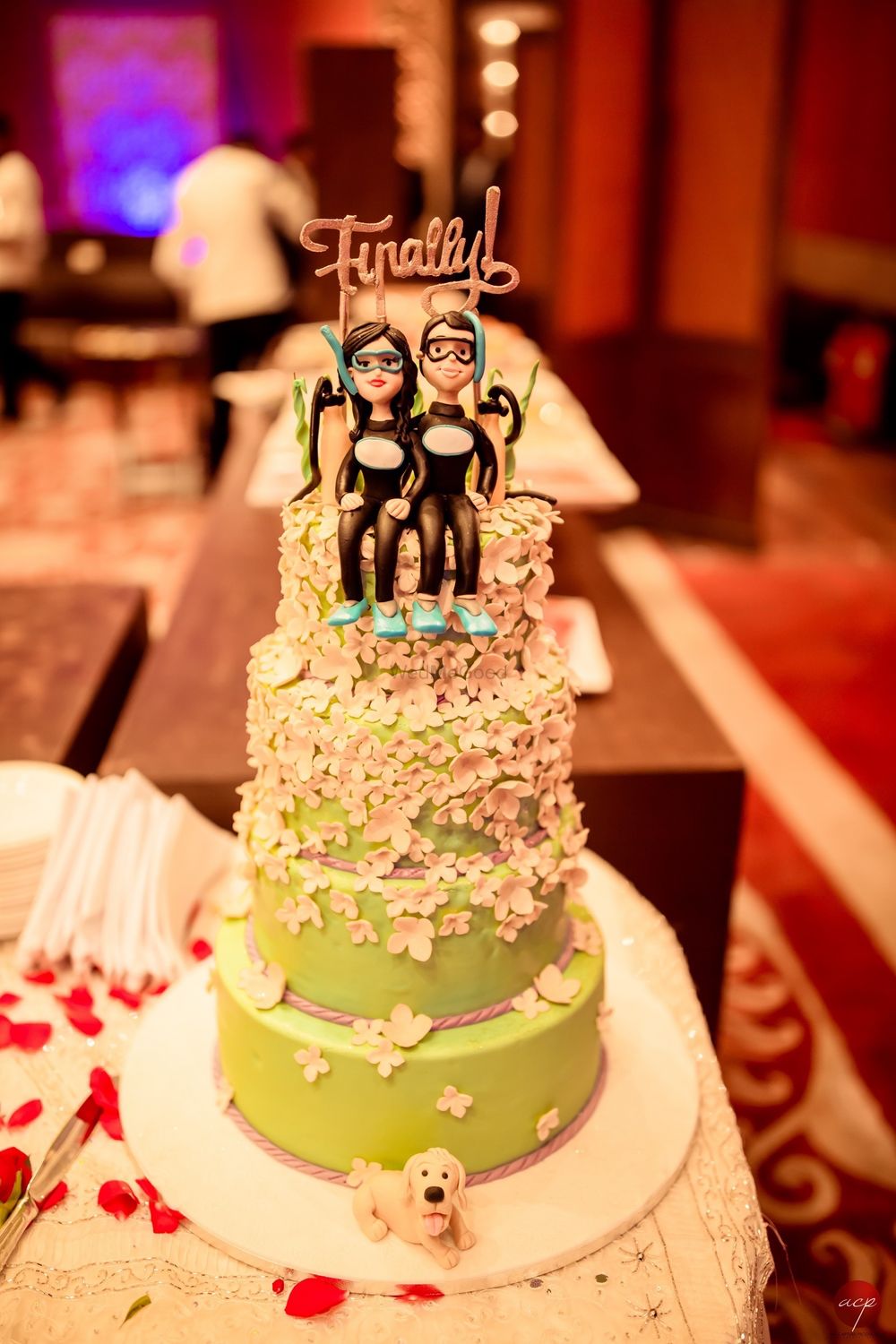 Photo of Wedding cake with diving cake topper