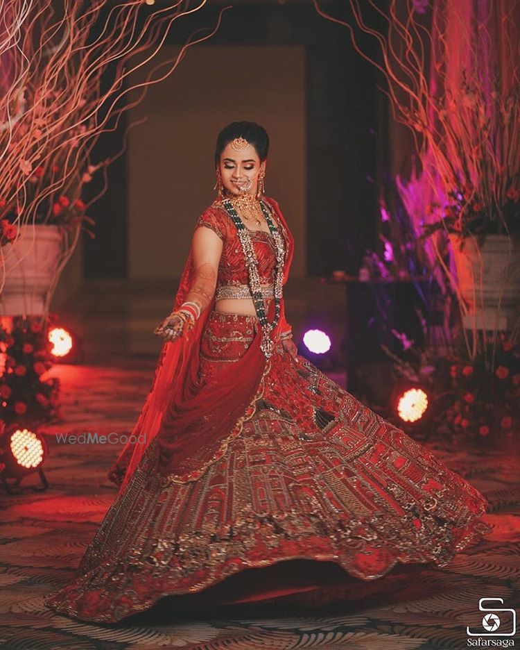 Photo of Beautiful red and gold bridal lehenga with long rani haar