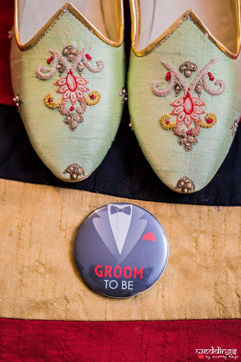 Photo of Groom shoes and badge