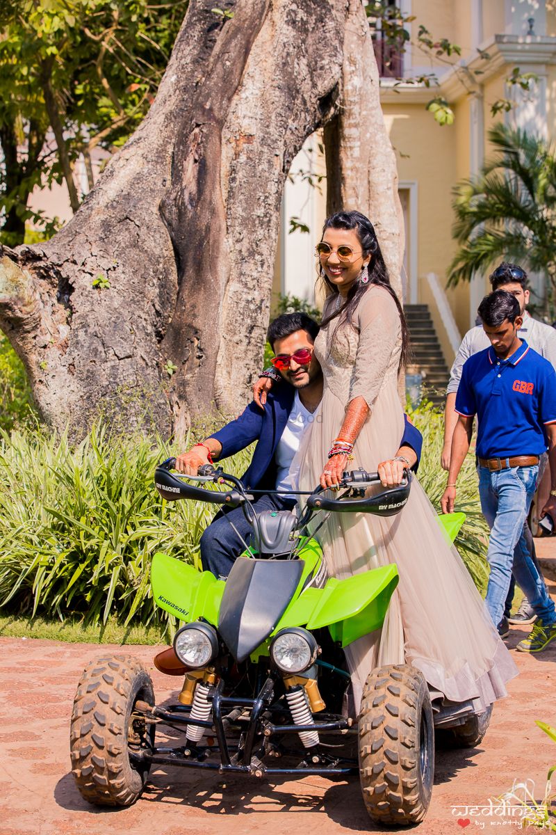 Photo of Bride and groom entering on ATV