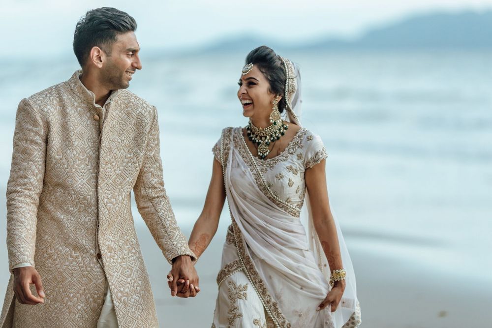 Photo of Beach wedding with happy couple shot