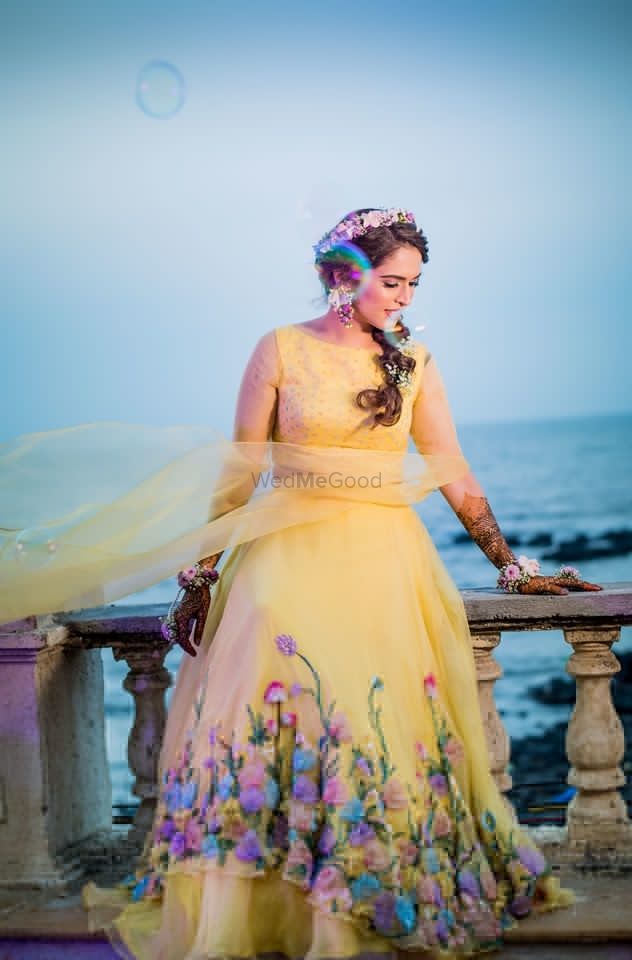 Photo of Mehendi gown in yellow with appliqué work