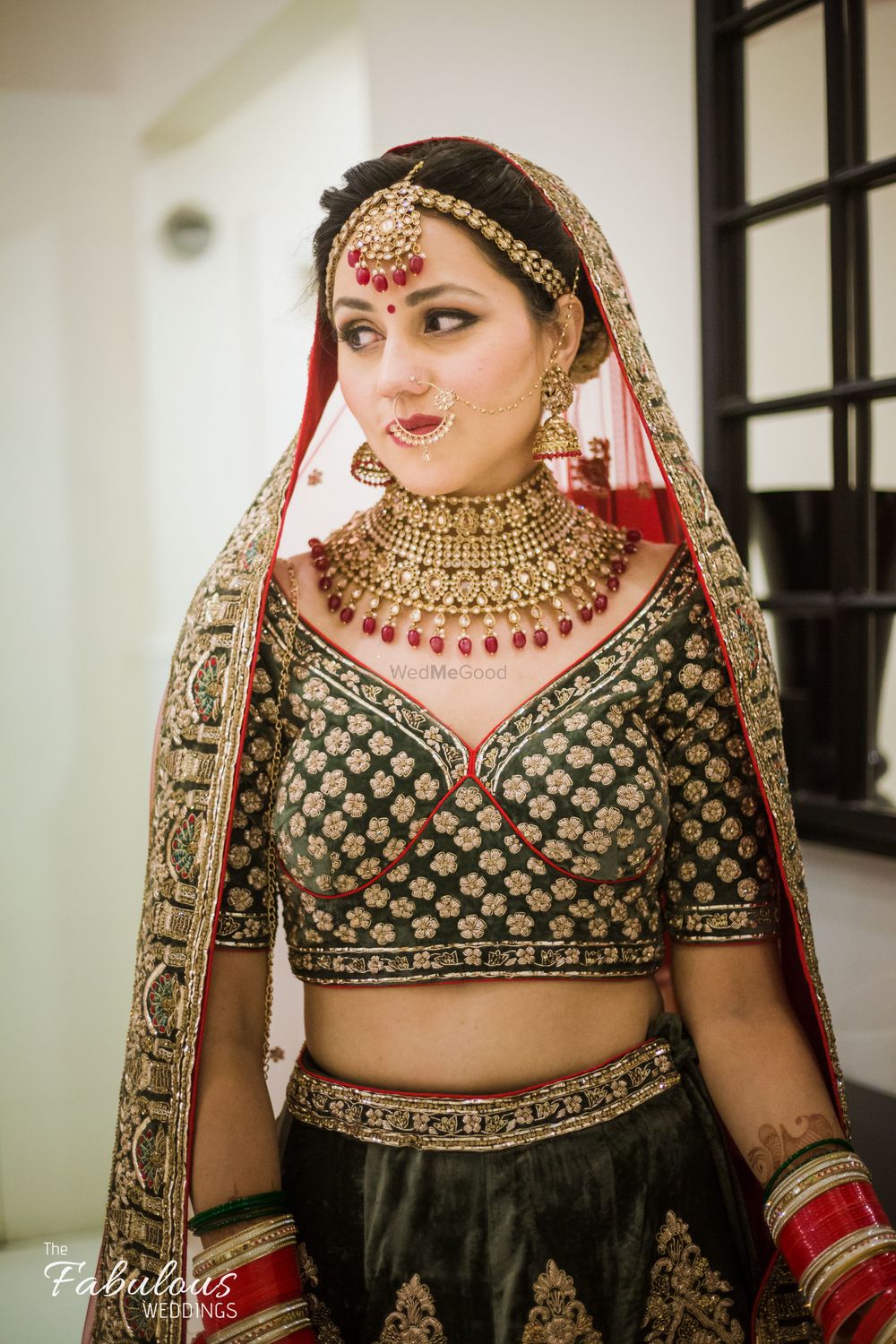 Photo of Red and black bridal lehenga with unique blouse