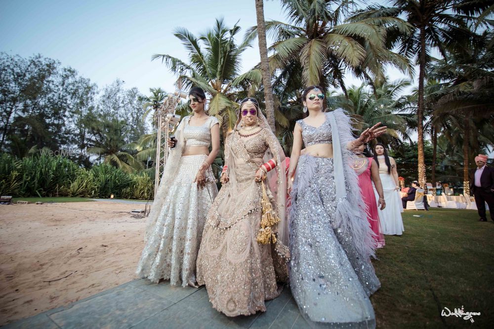 Photo of Bride and sisters in pastel outfits