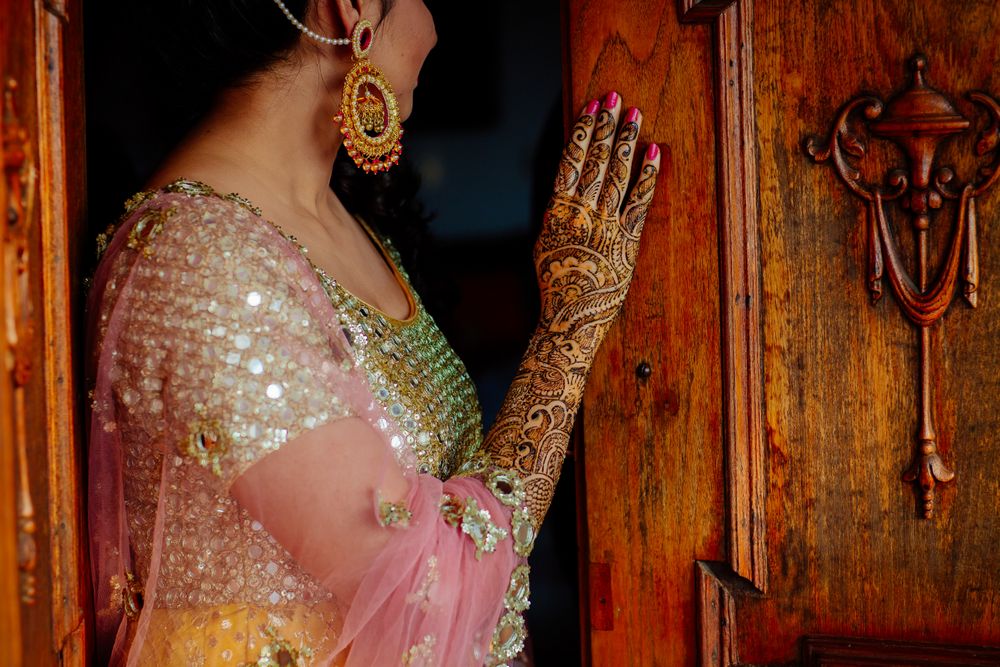 Photo of Mehendi bridal portrait showing off mehendi