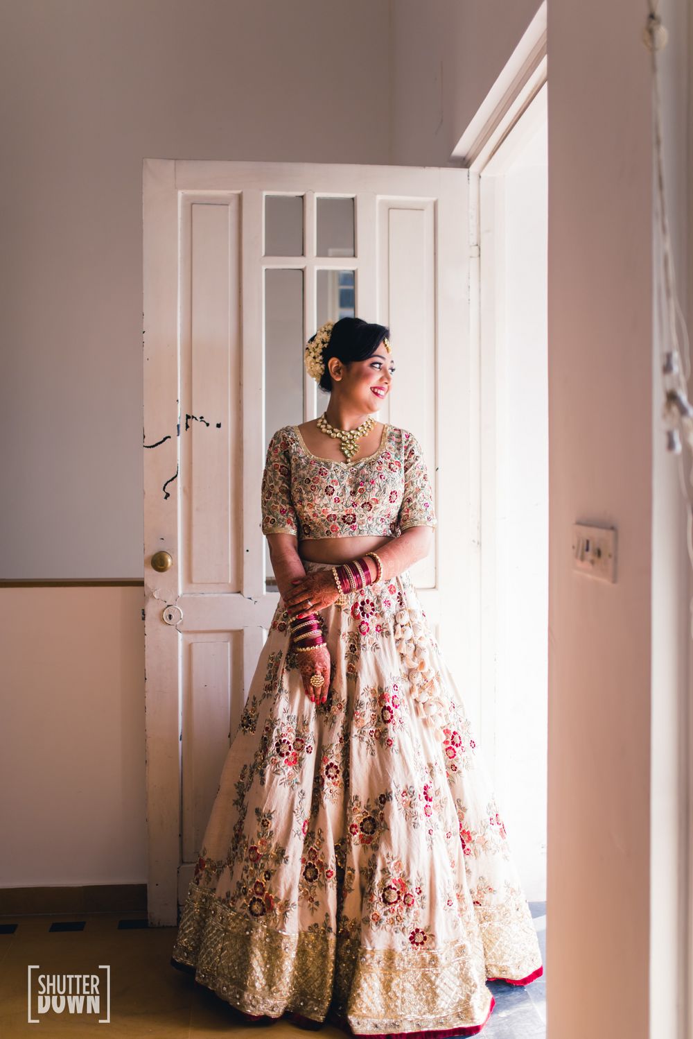 Photo of Offwhite and red lehenga with floral embroidery