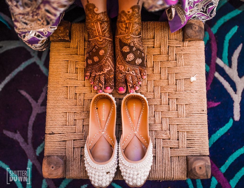 Photo of Mehendi bridal feet and juttis with pearls