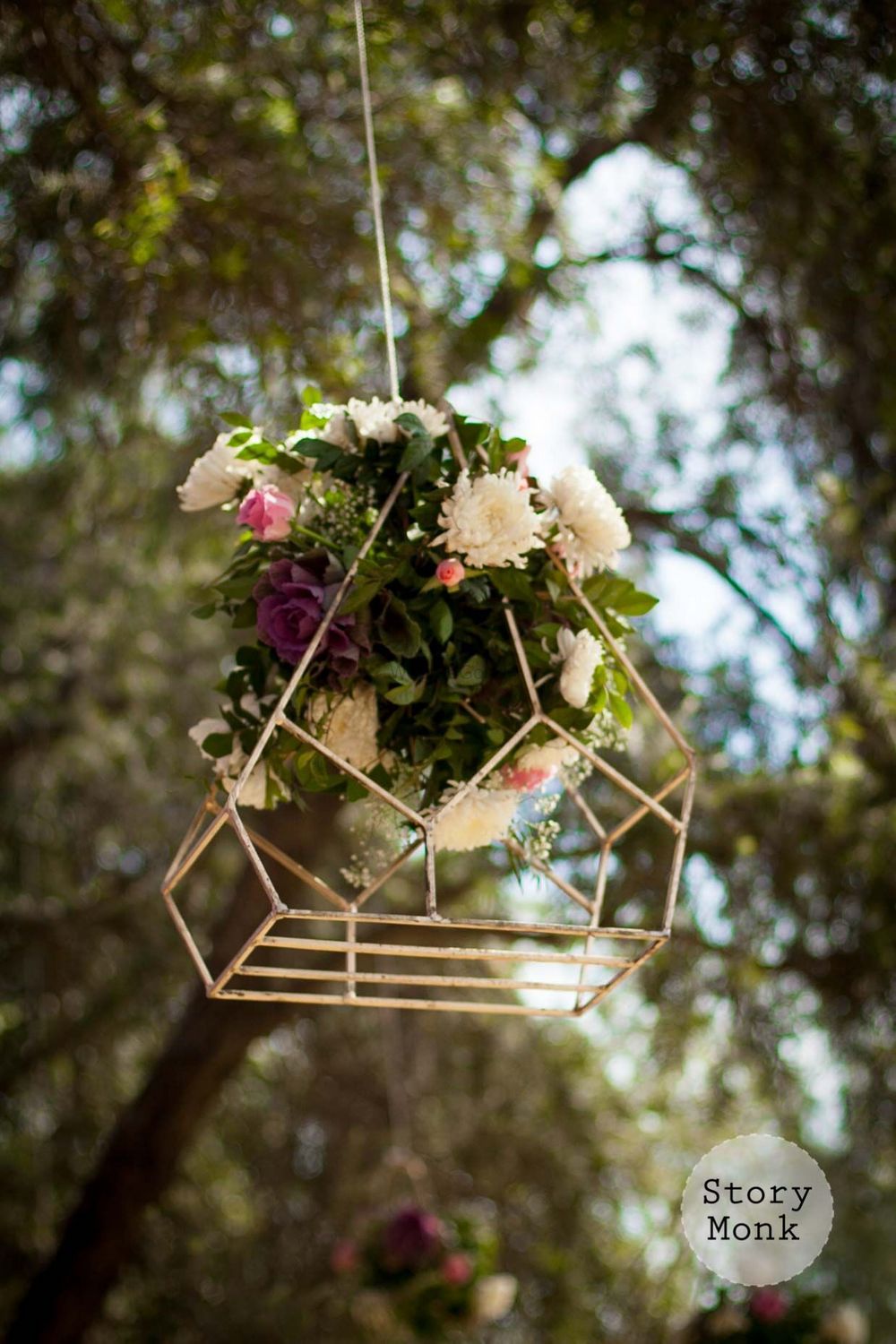Photo of Hanging floral arrangement in geometric decor