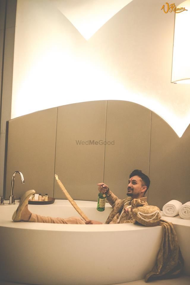 Photo of Groom chilling before wedding in bath tub