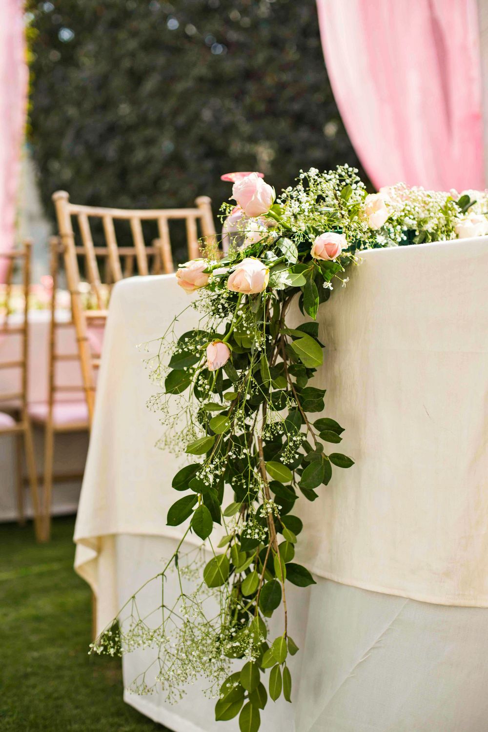 Photo of Stunning rose and greenery floral table runners for table arrangements