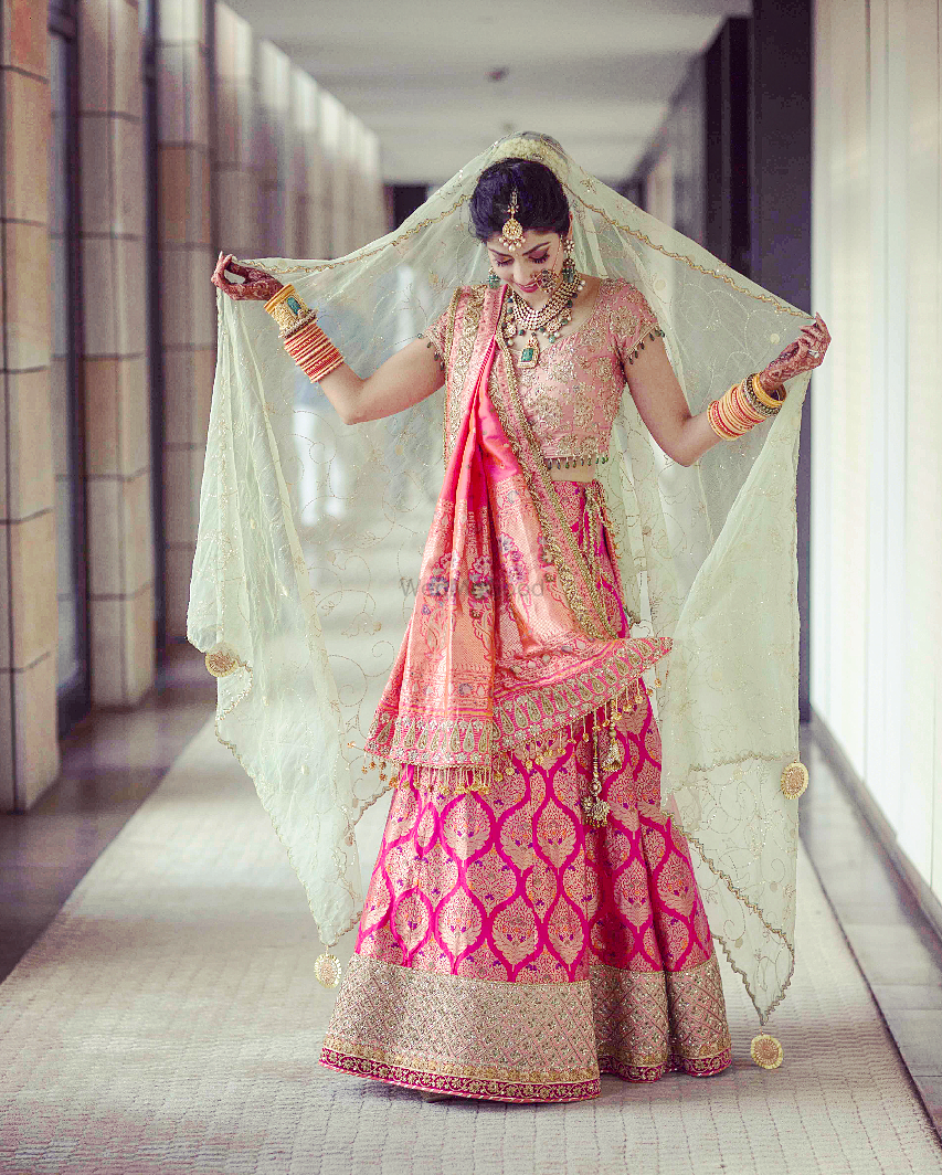 Photo of Bride in pink lehenga with mint dupatta