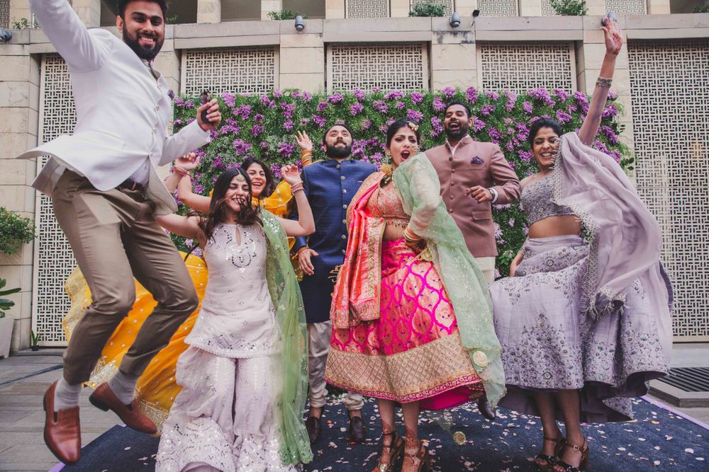 Photo of Happy bride shot with jumping people