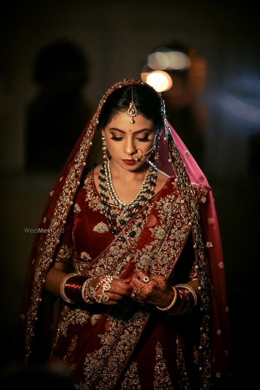 Photo of Maroon bridal lehenga with darker jewellery