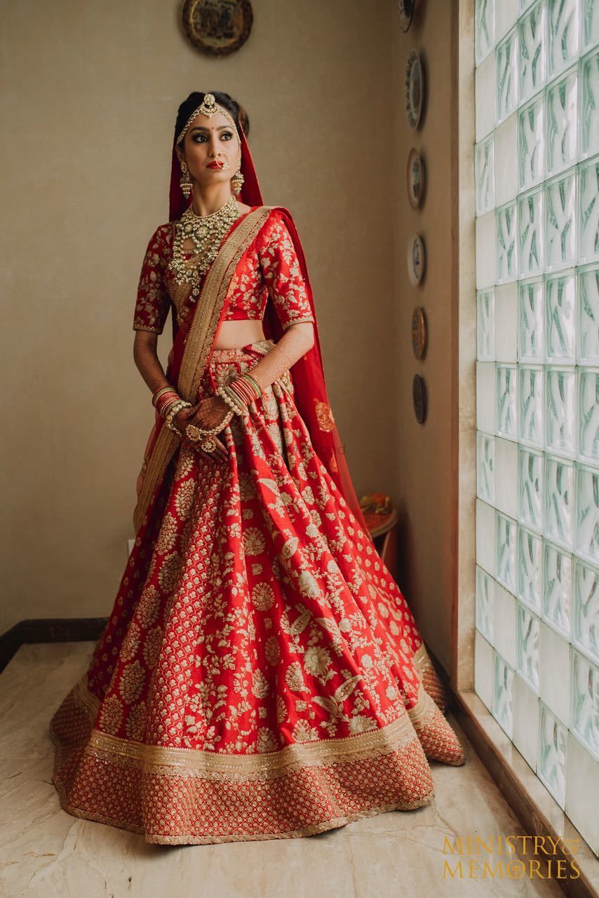 Photo of Red and gold bridal lehenga with floral work embroidery