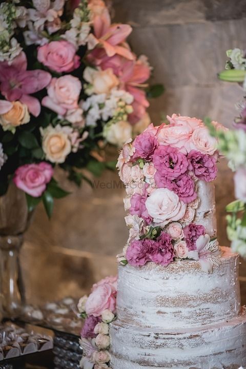 Photo of Rustic wedding cake with floral design