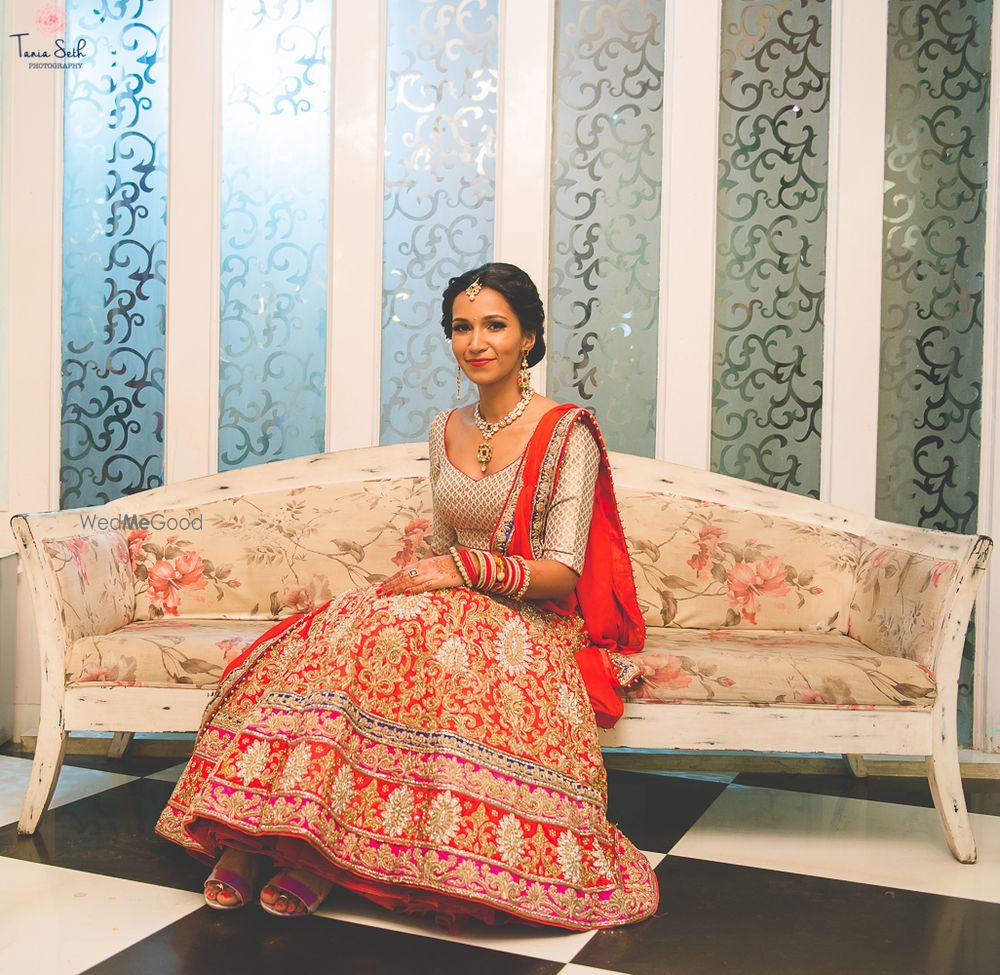 Photo of Light grey and red bridal lehenga