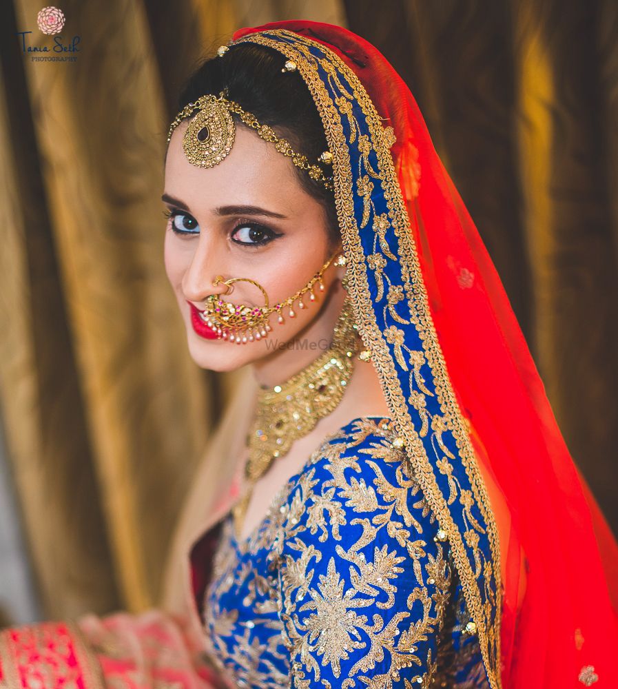 Photo of ink blue and red lehenga