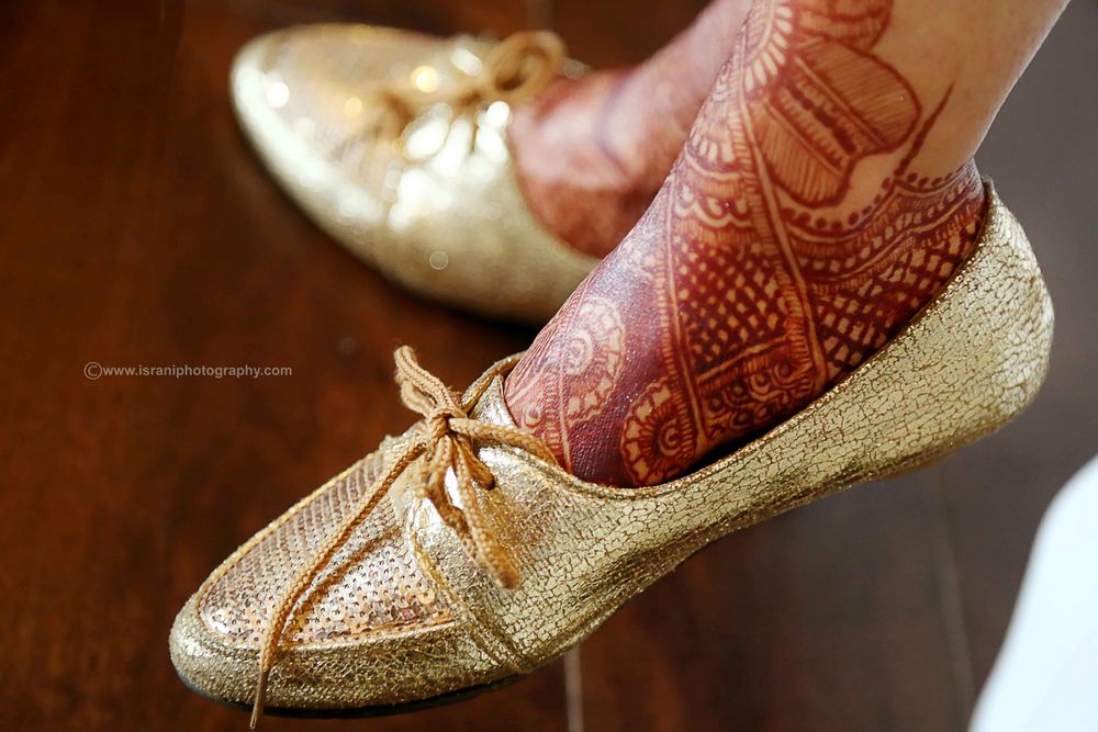 Photo of gold flat shoes