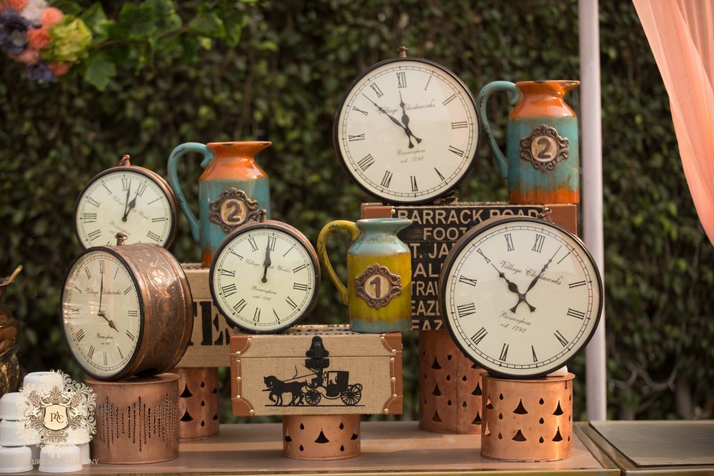 Photo of Unique vintage clocks and trunks themed decor for a day function