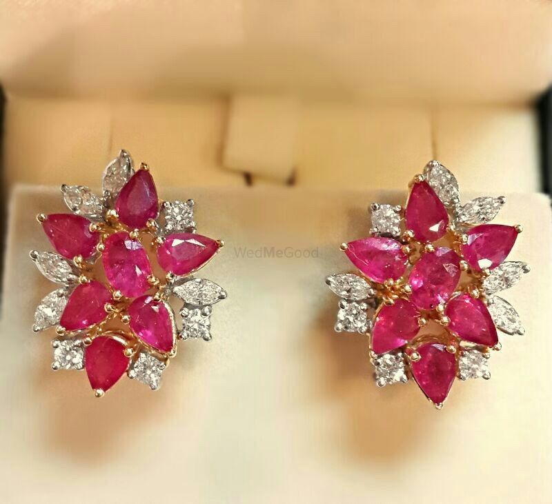 Photo of rubies and diamonds stud earrings
